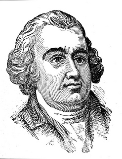 Thomas Burke. He is wearing a coat and collared shirt. He looks to be wearing a powdered wig. He is heavy set and is smiling.